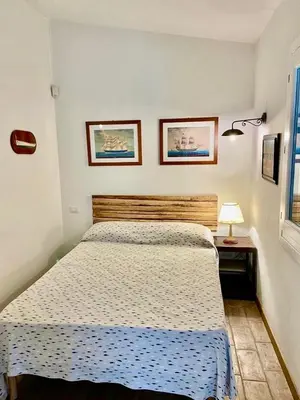Letto o letti in una camera di Villa Tre Mari - Casa Caterina