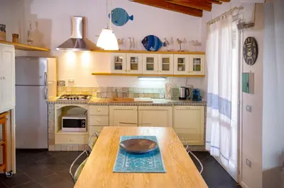 Cucina o angolo cottura di Villa Isuledda Prestige
