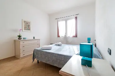 Letto o letti in una camera di Residence La Corte Di Anastasia