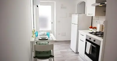 Cucina o angolo cottura di Casa al mare Orchidea - Motoparking - Wifi Free - AC