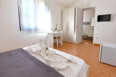 Letto o letti in una camera di Casa Basilia