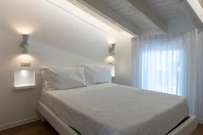 Letto o letti in una camera di In Centro da Viola - Eco Design Rooms