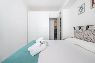 Letto o letti in una camera di appartamento famiglia Marizzola