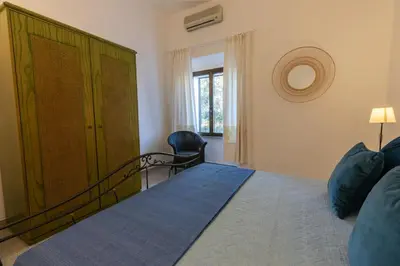 Letto o letti in una camera di Stazzo San Teodoro L'Olivastro Piscina Condivisa