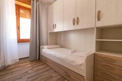 Letto o letti in una camera di Casa Riccio
