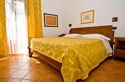 Letto o letti in una camera di Hotel Il Querceto