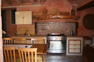 Cucina o angolo cottura di B&B Sa Madalena a Dorgali-IUN E4918