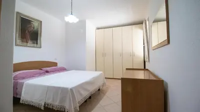 Letto o letti in una camera di Residenza La Pineta Orosei