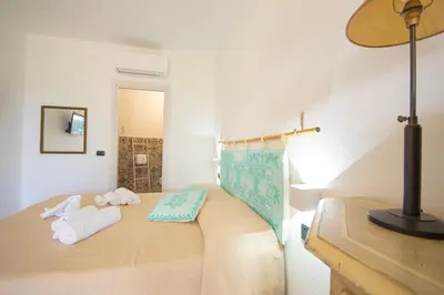 Letto o letti in una camera di HOTEL Essenza di Mirto