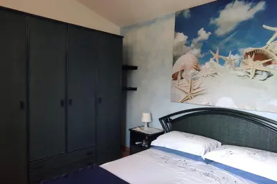 Letto o letti in una camera di Villa Janas con piscina privata Budoni