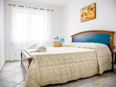 Letto o letti in una camera di Casa Doride - Cala Gonone
