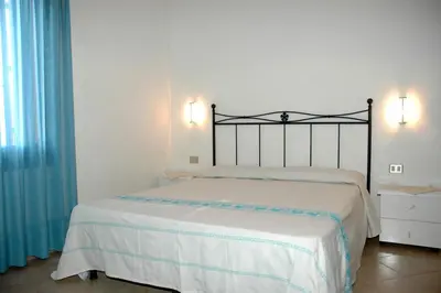 Letto o letti in una camera di La Conchiglia ME