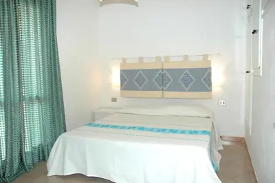 Letto o letti in una camera di La Conchiglia ME