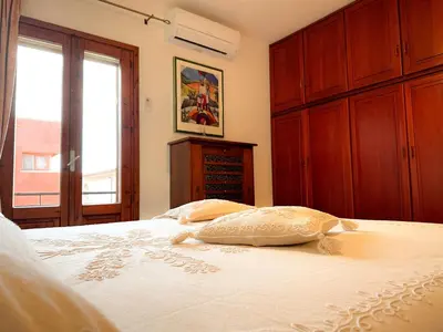 Letto o letti in una camera di Appartamento vicino al centro di Olbia