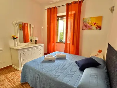 Letto o letti in una camera di Gli ulivi -Appartamento al centro
