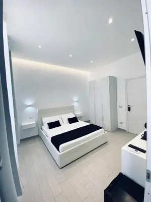 Letto o letti in una camera di International House Olbia