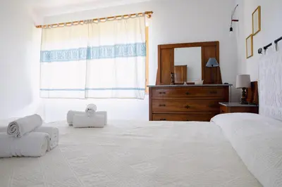 Letto o letti in una camera di Residenze di Via Magnolie