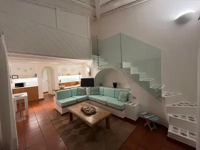 Area soggiorno di BouganVilla by the Beach - San Teodoro 1