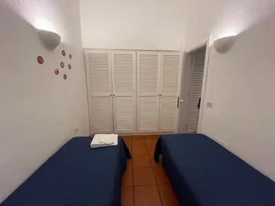 Letto o letti in una camera di BouganVilla by the Beach - San Teodoro 1