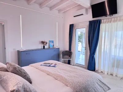 Letto o letti in una camera di Baia del Sole Resort