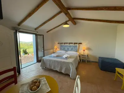 Letto o letti in una camera di Panoramic Loft con uso cucina,Casa Placida - Ammentos