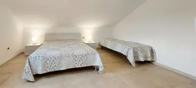 Letto o letti in una camera di Appartamento Brigida Bilocale 3 posti vicino al centro