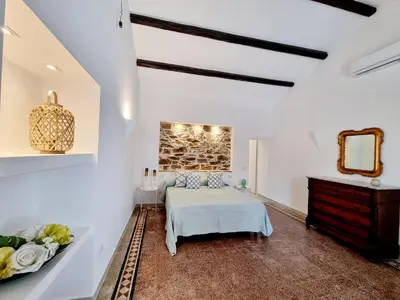 Letto o letti in una camera di STAZZO SAN TEODORO LA QUERCIA Piscina Condivisa