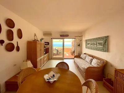 Letto o letti in una camera di SAN TEODORO PUNTA EST STUPENDO TRILOCALE VISTA MARE
