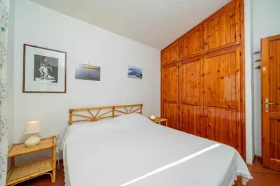 Letto o letti in una camera di Villetta Cala D'Ambra