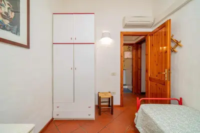 Letto o letti in una camera di Villetta Cala D'Ambra