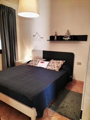 Letto o letti in una camera di Casa Dory