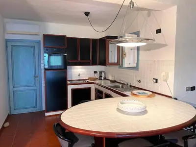 Cucina o angolo cottura di SAN TEODORO PUNTA EST SPETTACOLARE QUADRILOCALE VISTA MARE