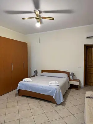 Letto o letti in una camera di Luciana House