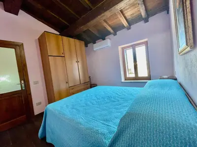 Letto o letti in una camera di Nel Cortile della Casa di Carta, due Singole Unità