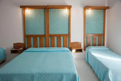 Letto o letti in una camera di Albergo Miramare