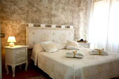 Letto o letti in una camera di Villa Vittoria San Teodoro