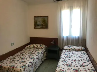 Letto o letti in una camera di Casa Isidoro