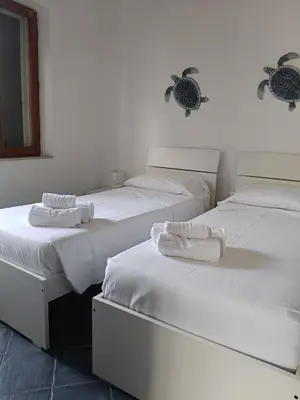 Letto o letti in una camera di Trilo Lu Rattali