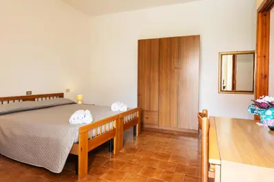 Letto o letti in una camera di Hotel L'Aragosta
