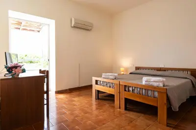 Letto o letti in una camera di Hotel L'Aragosta