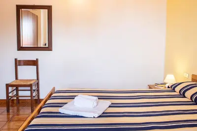 Letto o letti in una camera di Hotel L'Aragosta