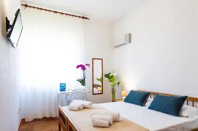 Letto o letti in una camera di Hotel L'Aragosta