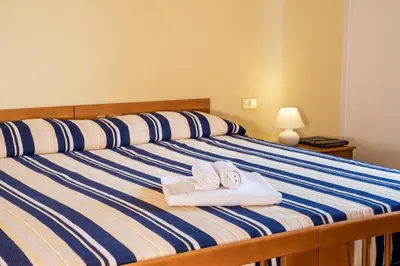 Letto o letti in una camera di Hotel L'Aragosta