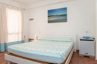 Letto o letti in una camera di La casetta di Lu Casteddu