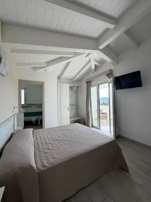 Letto o letti in una camera di Villa Lentischio