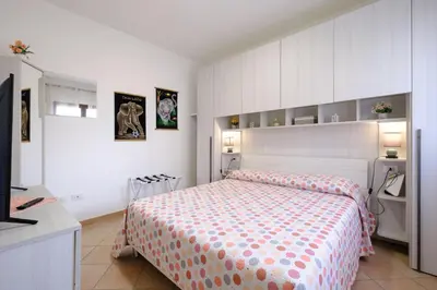 Letto o letti in una camera di Holiday Olbia - Appartamento a due passi dal lungomare e centro città