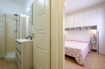 Letto o letti in una camera di Holiday Olbia - Appartamento a due passi dal lungomare e centro città