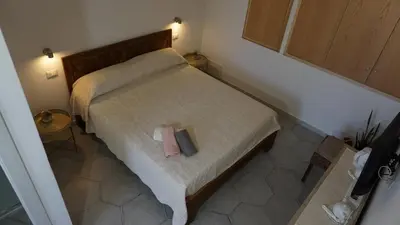 Letto o letti in una camera di Li Petri Manni