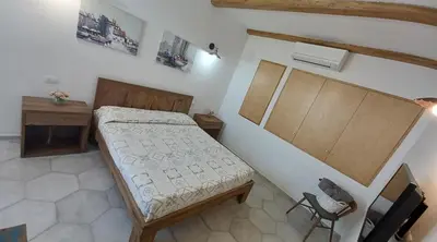 Letto o letti in una camera di Li Petri Manni