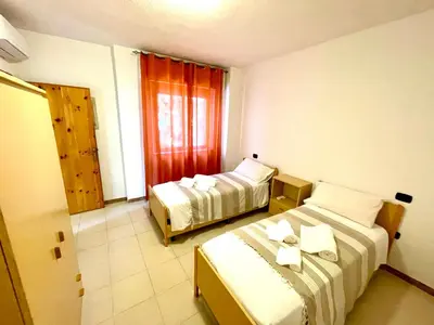 Letto o letti in una camera di APPARTAMENTO LA CALETTA VACANZE